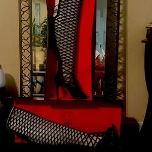 Black, Vince Camuto, high heeled boot. Never worn…in original box.